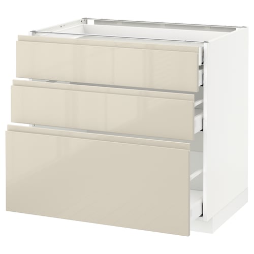 Modern beige kitchen cabinet with high gloss finish, three drawers, and sleek design.