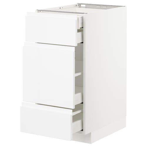 White high-gloss METOD cabinet with sleek pulls and smooth drawers, modern and spacious kitchen design.