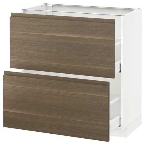 A modern kitchen cabinet. The METOD system white and dark walnut effect drawers with integrated handles. The design is sleek and minimalist.