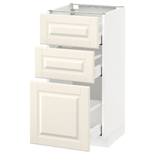 A white METOD kitchen cabinet in off-white with three drawers and a door. It a traditional design with bevelled edges.
