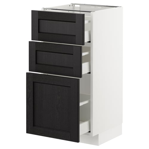 A white METOD kitchen cabinet with three black stained wooden drawers featuring bevelled edges.
