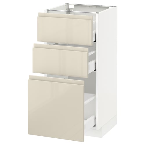 A white METOD kitchen cabinet with three high-gloss beige drawers.