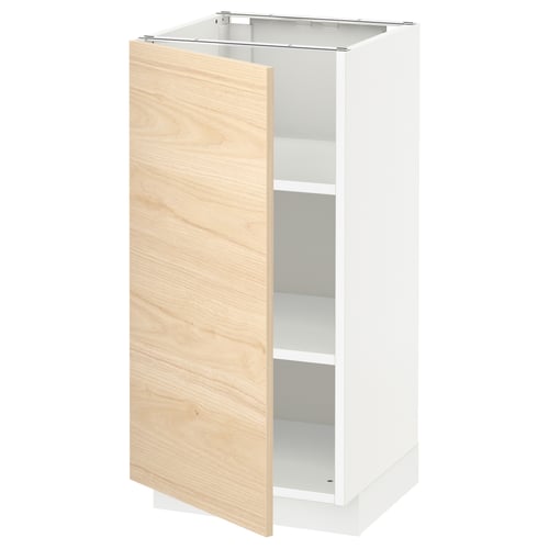 A white METOD kitchen cabinet with a light ash wood-patterned door, open to reveal an empty interior with adjustable shelves.