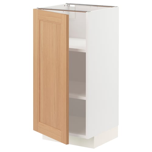 A METOD kitchen cabinet with a light oak door and white frame. It adjustable shelves and is designed for versatile kitchen organisation.