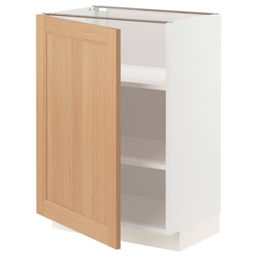 An open ikea METOD kitchen cabinet in white with a light oak door. The cabinet has two shelves.