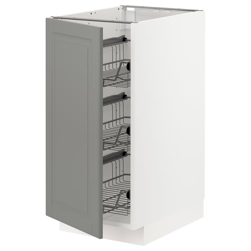 A grey METOD kitchen cabinet with pull-out wire baskets for storage.