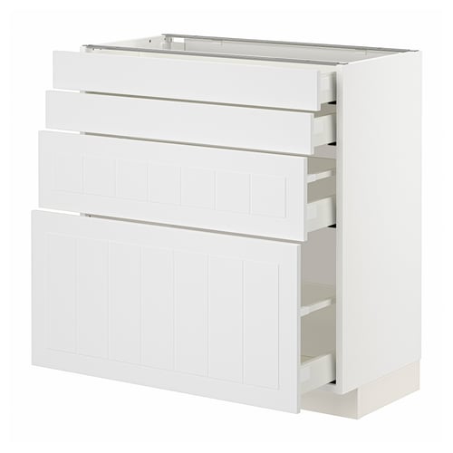 A white METOD kitchen cabinet with multiple drawers and shelves, featuring a sleek, modern design with a sturdy frame and smooth-running drawers.