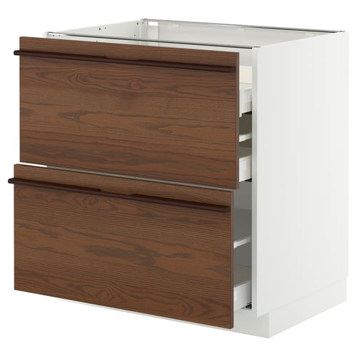 White ikea METOD kitchen cabinet with dark brown drawers and wood handles.