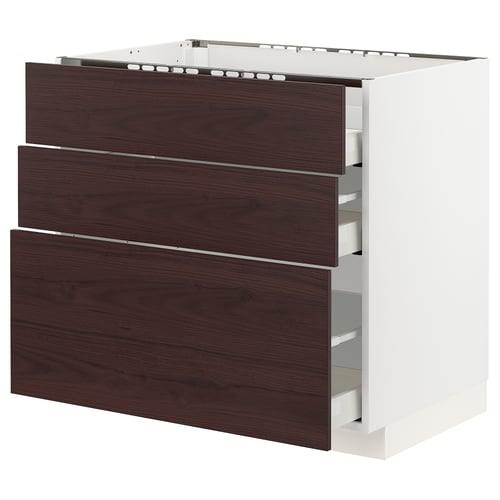 Modern kitchen cabinet with dark brown wooden drawers and white frame. Three drawers, sleek design.
