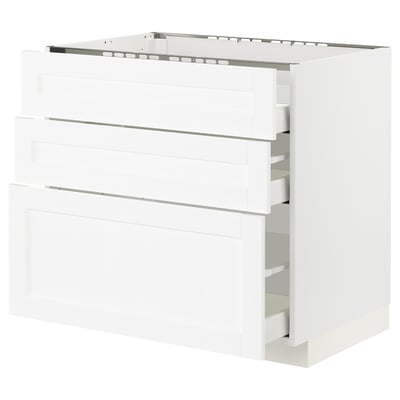 White METOD kitchen cabinet, three drawers, modern design, wooden texture.