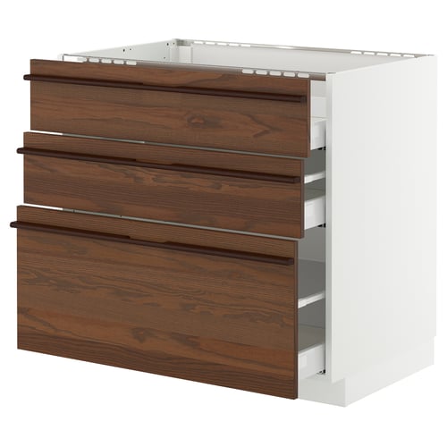 METOD kitchen unit with dark brown wooden drawers and white frame.