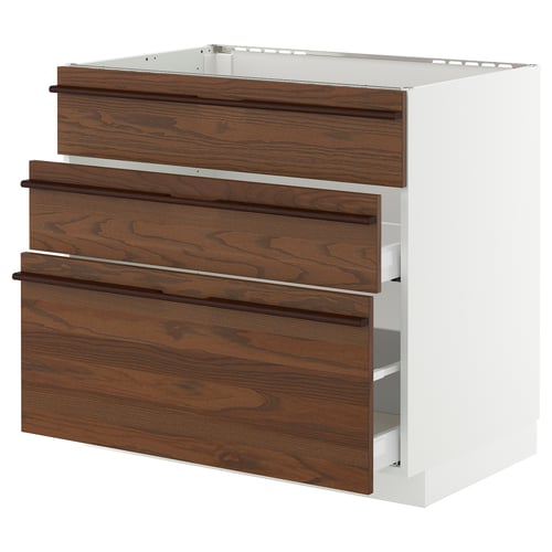 Dark wood veneer kitchen drawer unit with handles, white frame. Three drawers, sleek modern design.