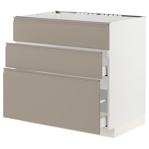 METOD kitchen cabinet in beige with integrated handles.