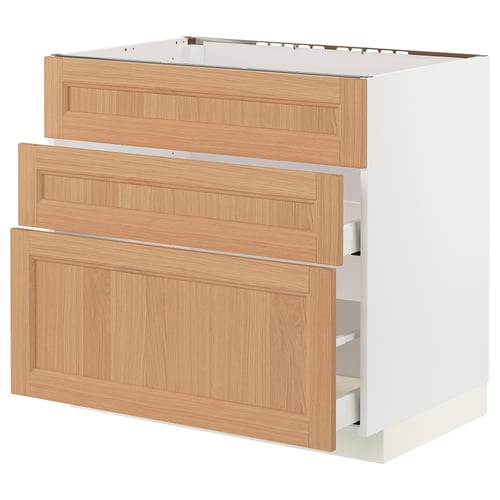 METOD kitchen cabinet in oak with three drawers, white frame. Modern, natural wood finish.