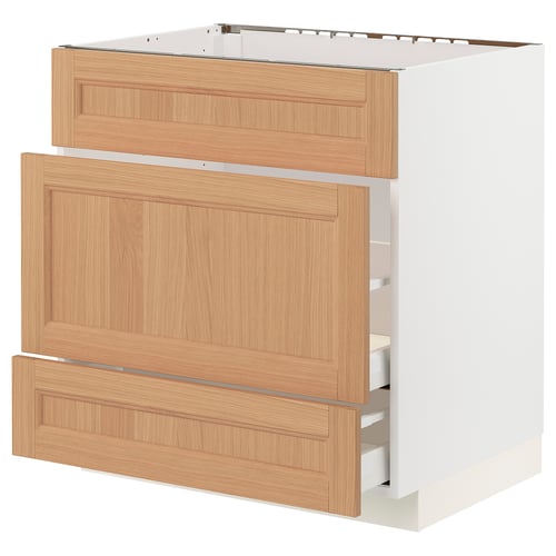 A white METOD kitchen cabinet with oak drawers, featuring a natural wood grain texture and soft-close drawers.