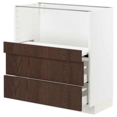 Modern kitchen unit with dark brown sinarp wooden drawers and white frame.