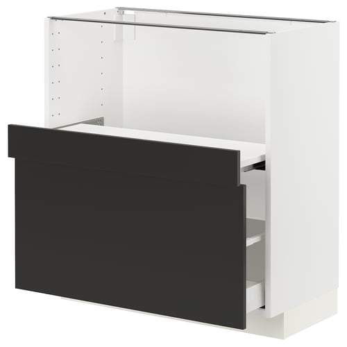 A white METOD kitchen cabinet with black nickebo drawer fronts. It a modern design and includes a smooth-running, full-extension drawer.