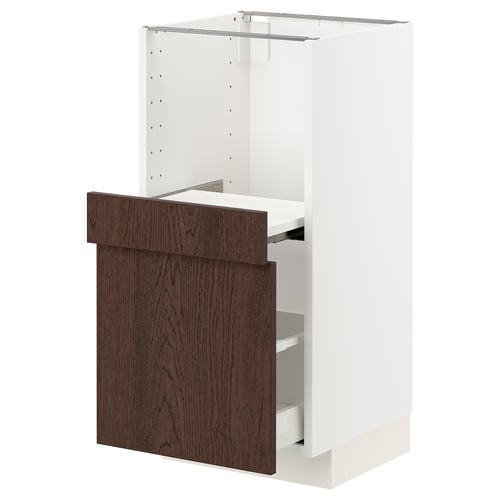 A modern white kitchen cabinet with dark brown wood doors and drawers. The design includes a pull-out shelf.