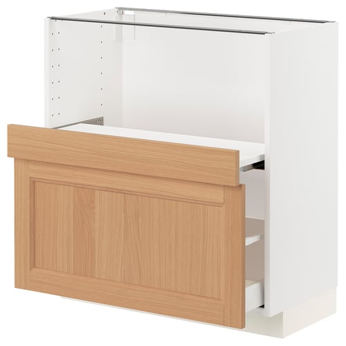 White METOD kitchen unit with oak drawer and pull-out shelf.