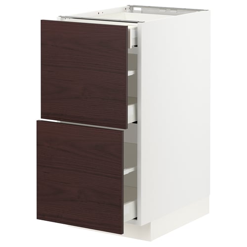 Dark brown wooden drawers on white METOD cabinet.