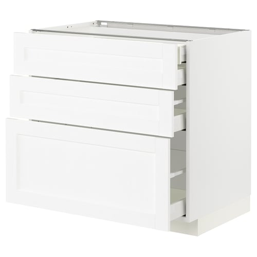 White modern kitchen cabinet with three drawers and sleek design.