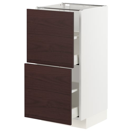 METOD kitchen cabinet with dark brown ash wood fronts, sleek white frame, and integrated drawers.