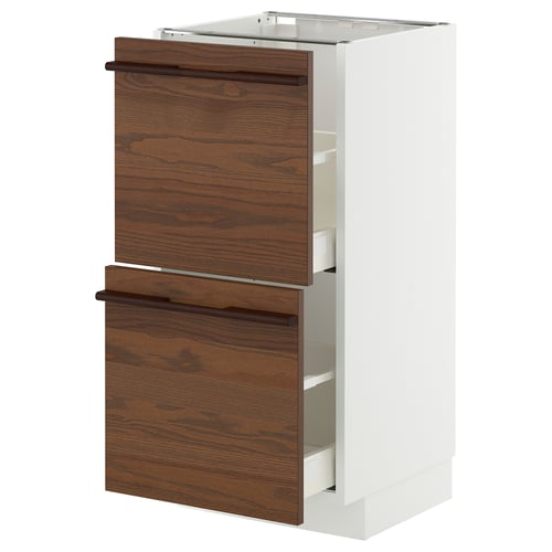 White and brown kitchen unit with wooden handles and drawers.