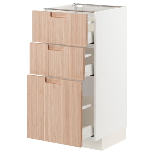 Ikea METOD kitchen unit, white and bamboo, three drawers open.