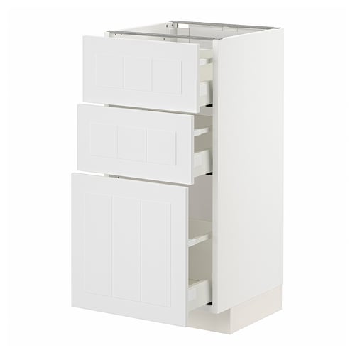 A white METOD kitchen cabinet with multiple drawers and doors, made of particleboard and melamine laminate, offering organised storage.