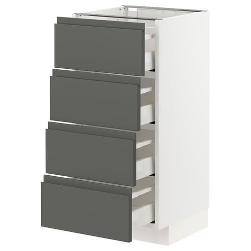 Modern white kitchen unit with four dark grey drawers, featuring integrated handles and smooth drawer opening mechanism.