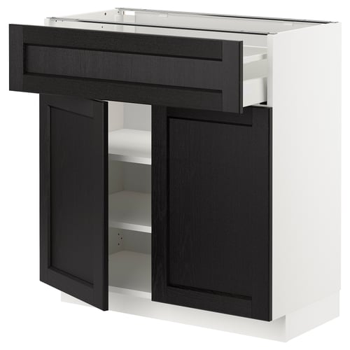 Black and white kitchen cabinet with dark drawers and shelves.