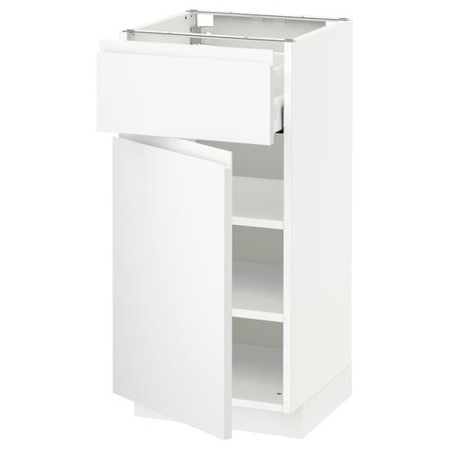 A white METOD kitchen cabinet with minimalist voxtorp design, including drawers and shelves.