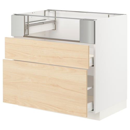 Wooden ikea METOD kitchen cabinet in natural ash, featuring multiple drawers and metal runners.