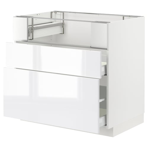 Modern white kitchen cabinet with high-gloss finish and smooth-running drawers.