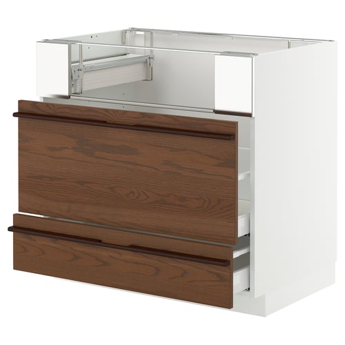 This image shows a white and dark brown kitchen cabinet. It has two wooden drawers with metal handles and an open top section.