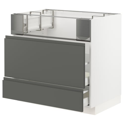 A modern, grey METOD kitchen cabinet with integrated handles and two open drawers.