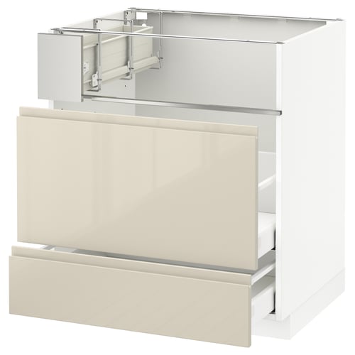 Modern white METOD kitchen cabinet with beige drawers and sleek design.
