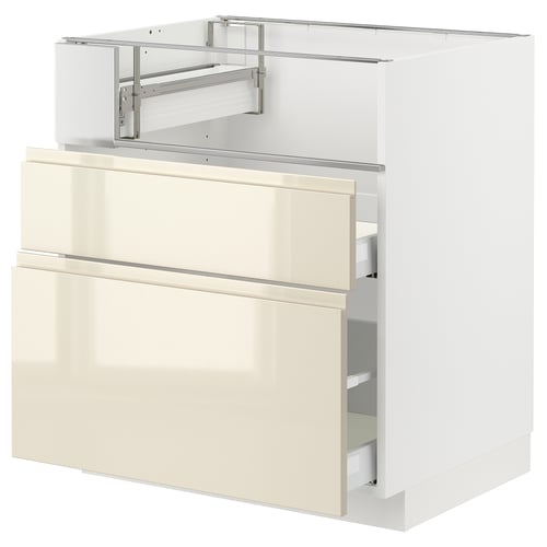 Modern white kitchen cabinet in high gloss beige with sleek design and integrated handles.