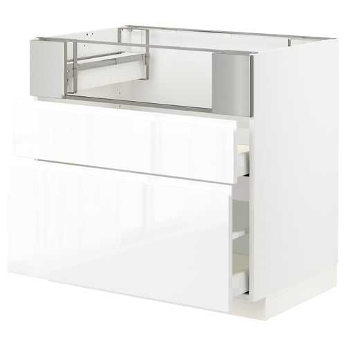 White high-gloss kitchen cabinet with pull-out drawers, modern design.