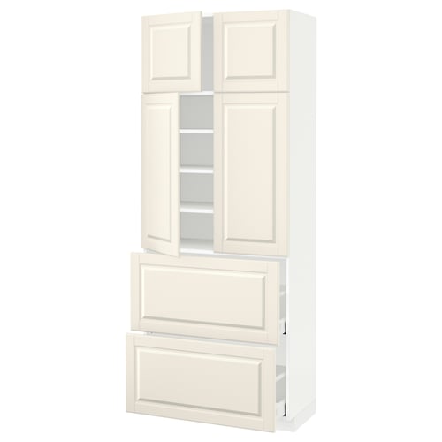 A tall white cabinet, METOD, with adjustable shelves and bevelled doors.