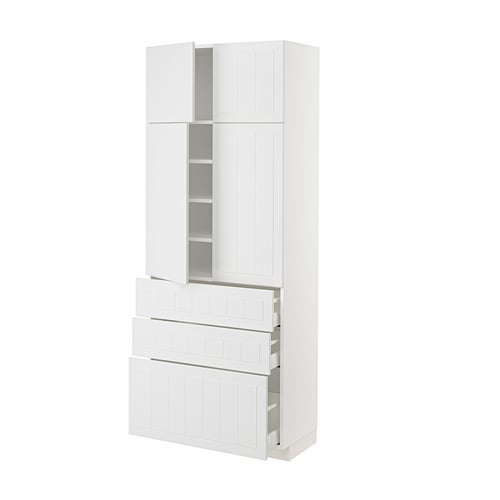 A white METOD kitchen unit with both cabinet doors and drawers, featuring a modern, crafted design.
