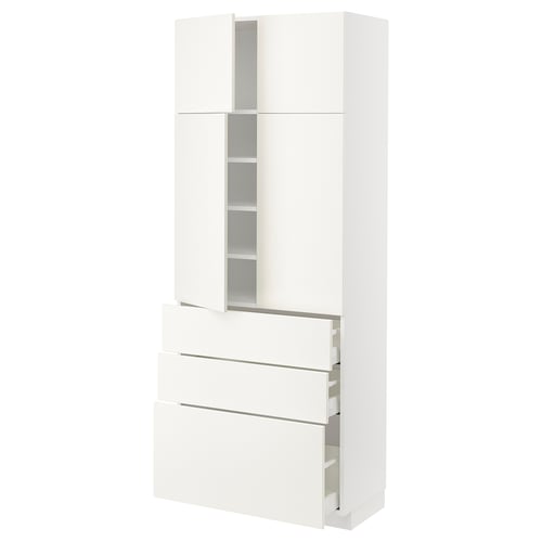 White METOD kitchen cabinet with drawers & shelves. Modern, glossy finish. Three drawers, two doors.