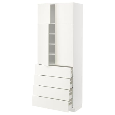 A white METOD kitchen cabinet with multiple drawers and shelves. Modern, clean-line design.