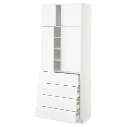 White high gloss METOD kitchen cabinet with integrated handles and pull-out drawers.