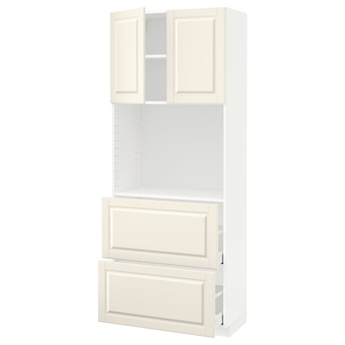 A white METOD kitchen cabinet system with off-white bodbyn fronts, featuring a traditional design with adjustable shelves and soft-closing drawers.