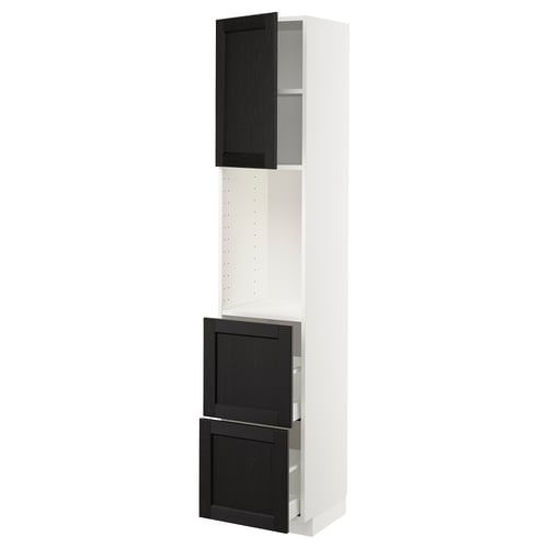 White tall kitchen cabinet with black stained wood doors and adjustable shelf.