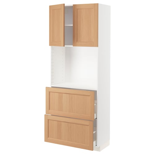 An ikea METOD kitchen unit with white and oak-colored doors. It a tall cabinet and drawers with a modern design.