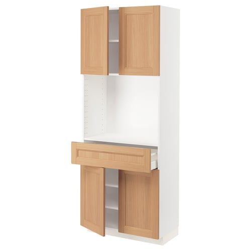An ikea METOD kitchen unit in white with light oak cabinets. It two open upper doors and one lower drawer.