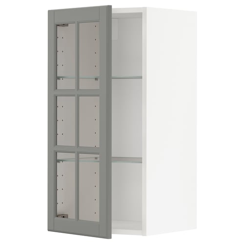 Grey METOD kitchen cabinet with glass doors and shelves.