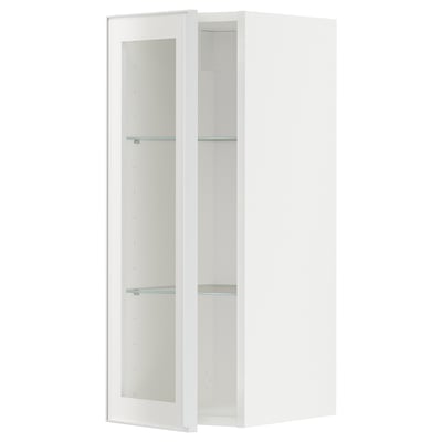 White METOD wall cabinet with clear glass shelves and metal-framed glass door.